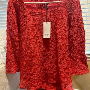 Red top with tags on. Brand new.